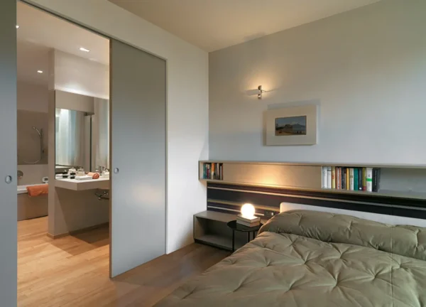 An Eclisses Syntesis Double Pocket Door in a Bedroom