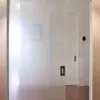 Front facing picture of a Cavity Slider Glass door hung with CS Glass Clamps